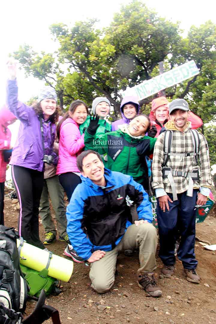 Taking Photo at The Peak of Mount Gede